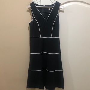 Black and white trimmed dress.